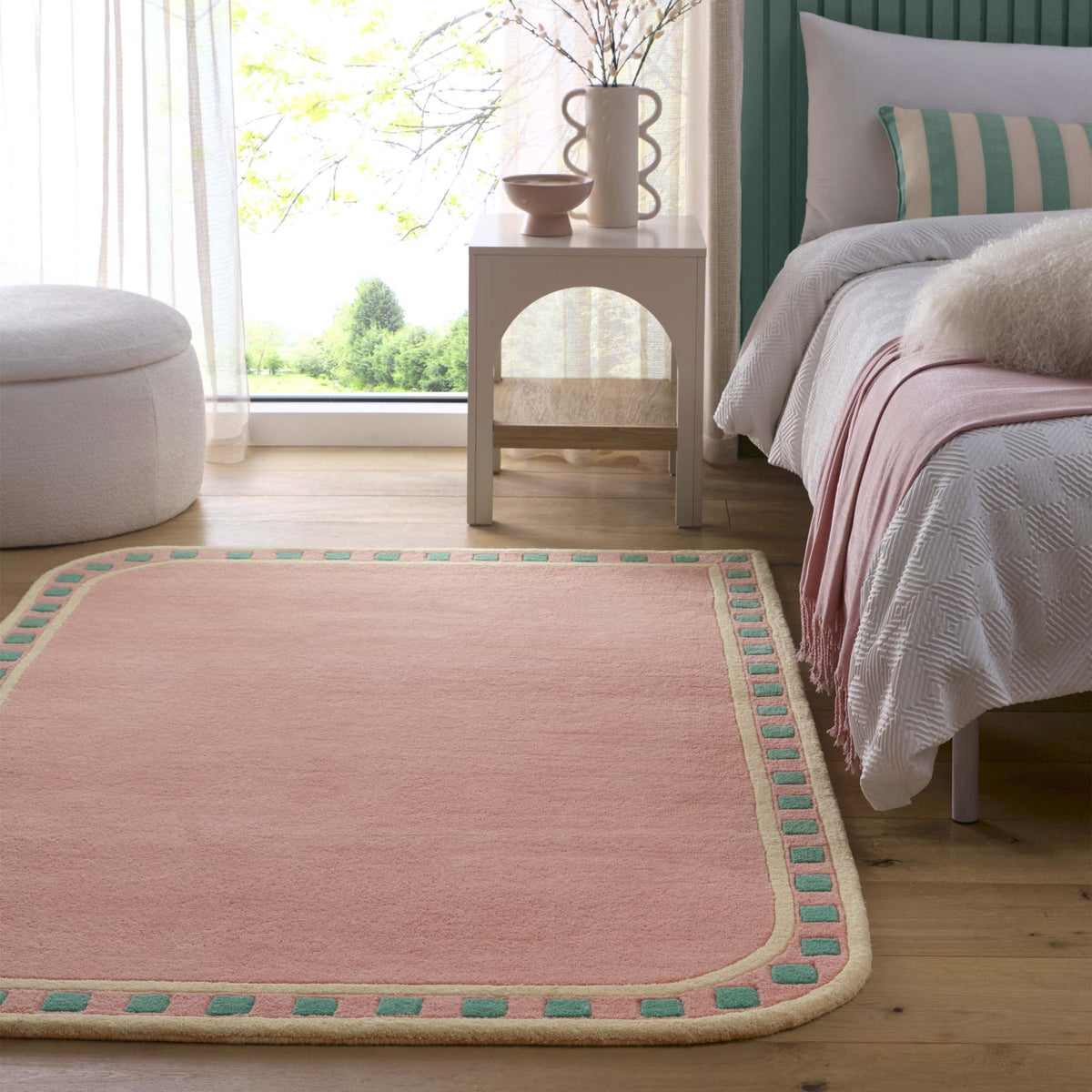 Borderline Pink Rug- 100% wool rug in pink with a geometric border.