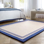 Piper Rug Navy- 100% wool rug with a purple and blue border. 