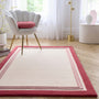 Orgins Piper Raspberry- 100% wool rug with a pink border.