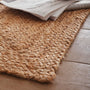 Close-up of Origins Jute Extra Natural Doormat with a jute woven design.