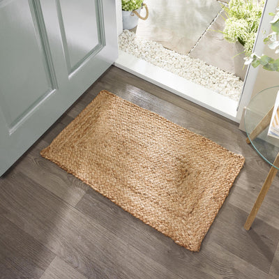 Origins Jute Extra Natural Doormat with a jute woven design, styled in a doorway.
