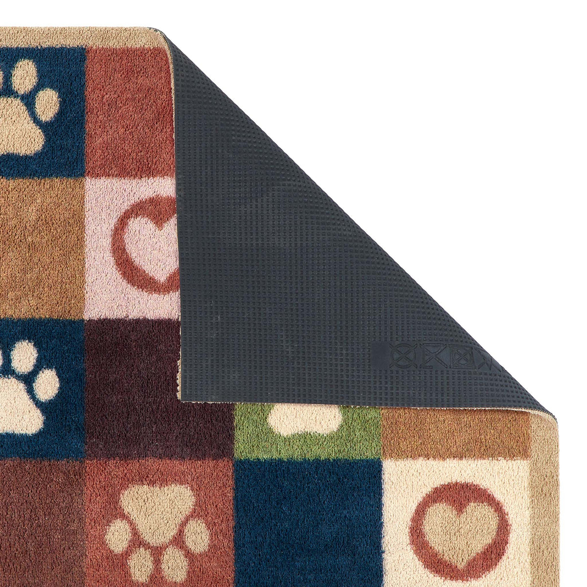 A close-up of a multicolor dog-themed doormat with a checkered pattern of paw prints, hearts, and paw pads in blue, brown, beige, and green, with the underside showing a dark gray textured non-slip backing.