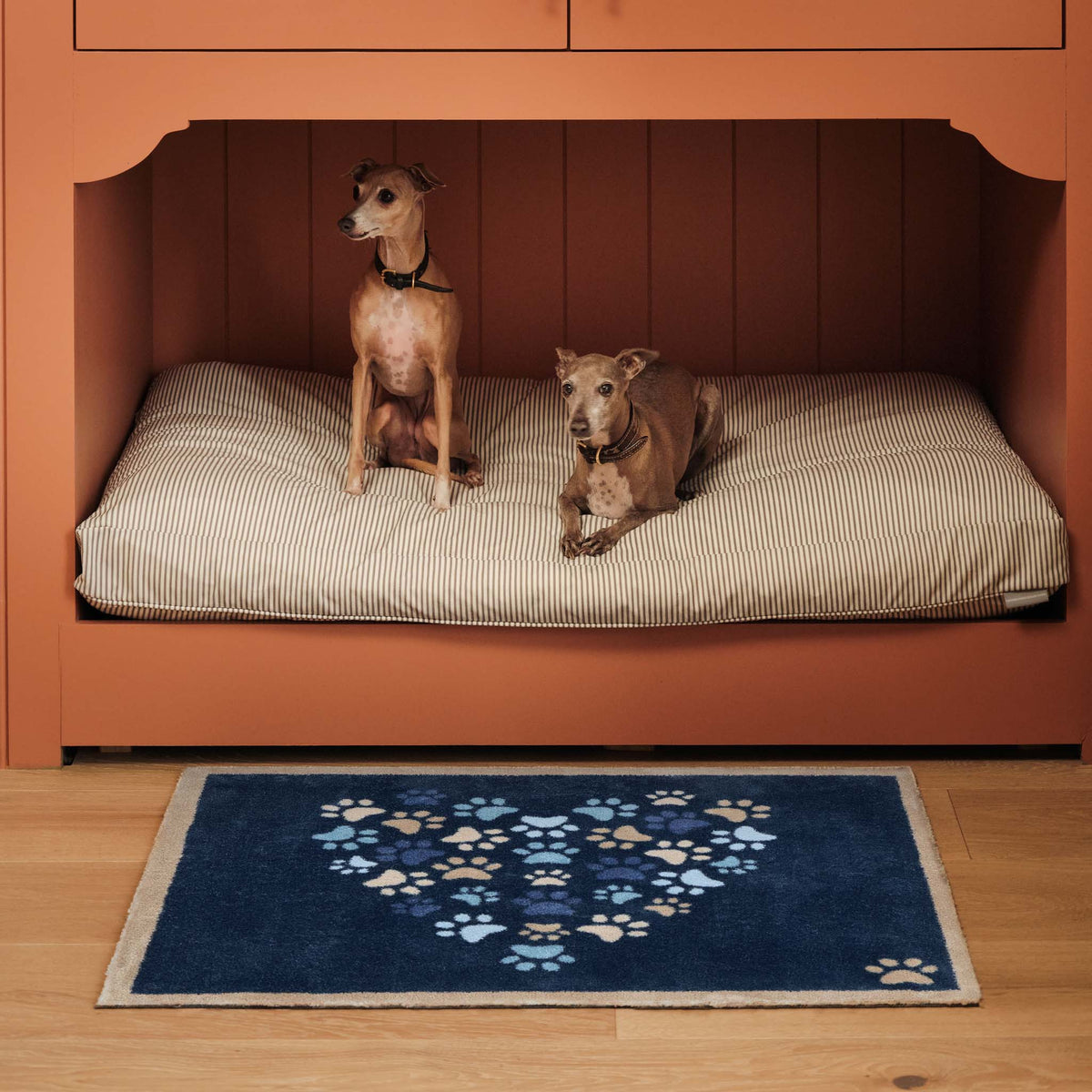Paws For Love Blue Doormat- 100% recycled cotton doormat featuring multi- directional paw prints in a heart shape. 