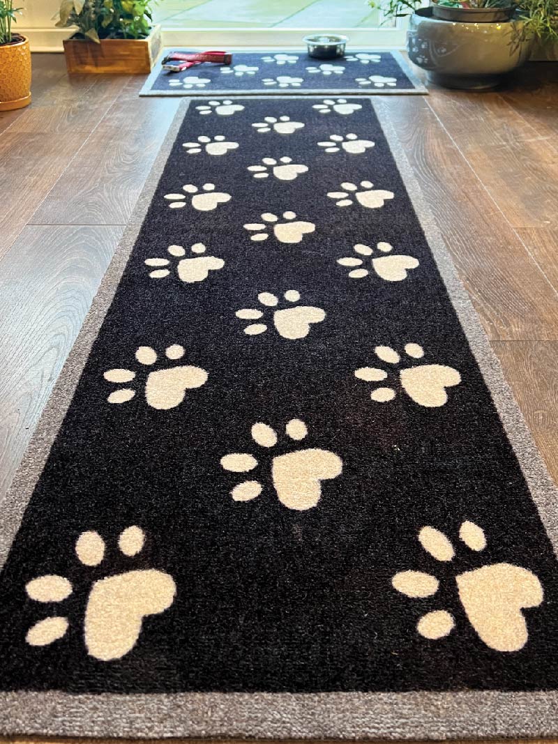 Matching paw print washable doormat and runner at back door from Howler & Scratch