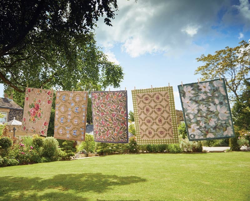 Nature themed washable doormats from Hug Rug hanging on a washing line