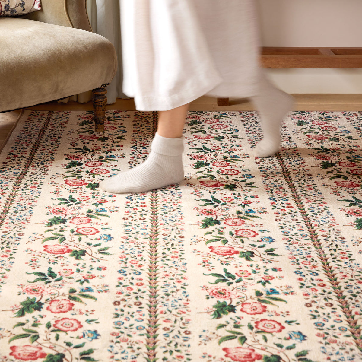 Close-up of Sanderson By Highgrove x Hug Rug Eco-Washable Rose Pergola Chintz Rug with a floral design.