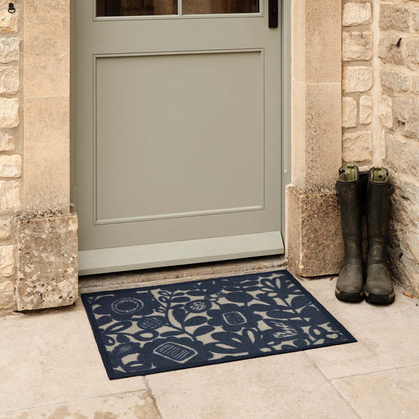 Kukkia Dark Navy Outdoor Doormat. Made from ECONYL regenerated yarn featuring a floral pattern.