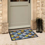 Hug Rug Outdoor Lintu Blue. Made from ECONYL regenrated yarn featuring Lintu Birds.