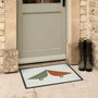 Hug Rug Outdoor Lintu Rust\Green. Made from ECONYL regnerated yarn featuring two Lintu Birds.