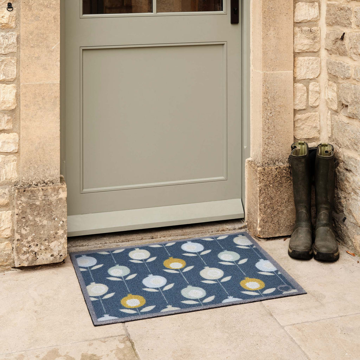 Pepino Blue Outdoor Doormat. Made from ECONYL regenerated yarn featuring a floral pattern.