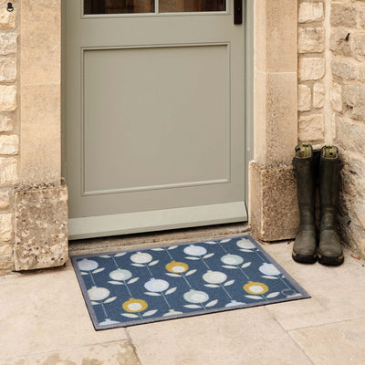 Pepino Blue Outdoor Doormat. Made from ECONYL regenerated yarn featuring a floral pattern.