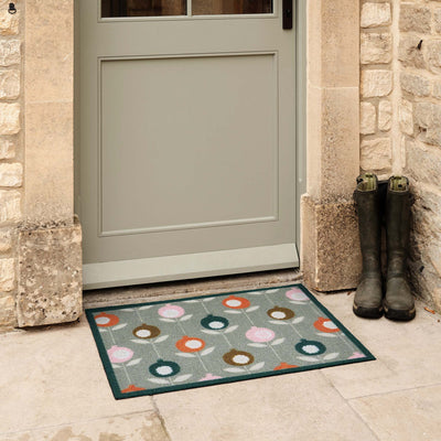 Pepino Green Outdoor Doormat. Made from ECONYL regenerated yarn featuring a floral design.