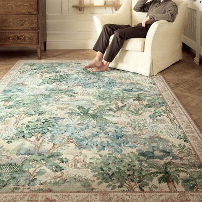 Sanderson By Highgrove x Hug Rug Eco-Washable The Stumpery Fern Rug with a nature inspired pattern, styled on wooden flooring. 