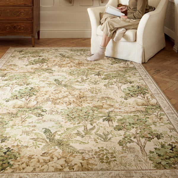 Sanderson By Highgrove x Hug Rug Eco-Washable The Stumpery Lichen with a nature inspired pattern, styled on wooden flooring.