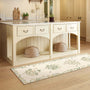 Sanderson By Highgrove x Hug Rug Eco-Washable Thyme Walk Lichen & Gooseberry Runner with a nature inspired pattern, styled on wooden flooring.