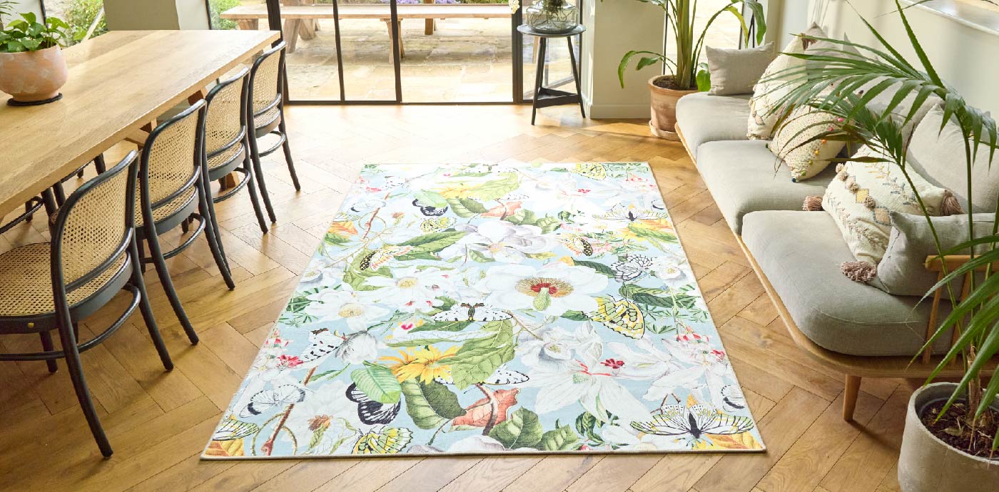 Butterly Blooms eco-washable rug from Hug Rug on dining room floor