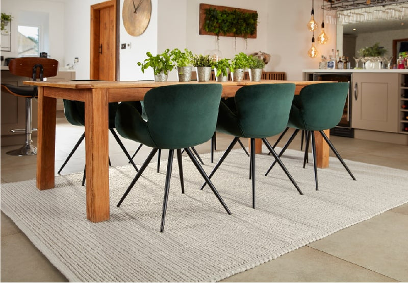 grey wool rug under a dining room table