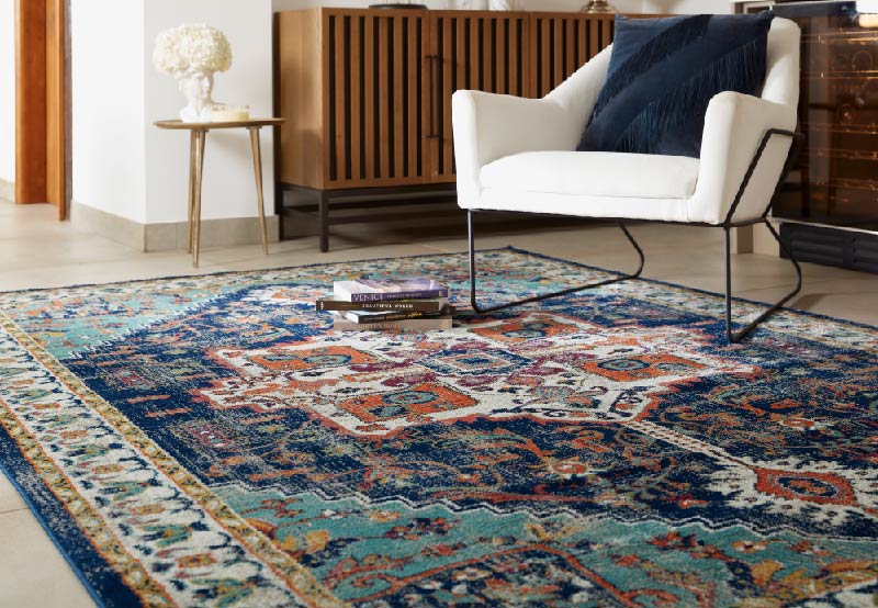 a large blue vintage rug in living room